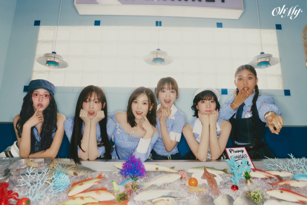 Image du groupe OH MY GIRL en tenues bleues